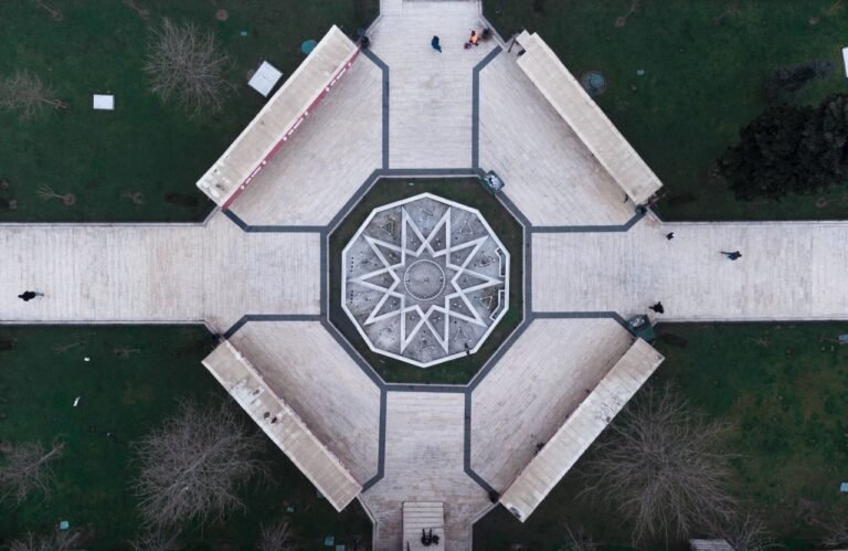 An aerial drone shot capturing a geometric walkway pattern in Istanbul, Turkey, featuring a central star-shaped design.