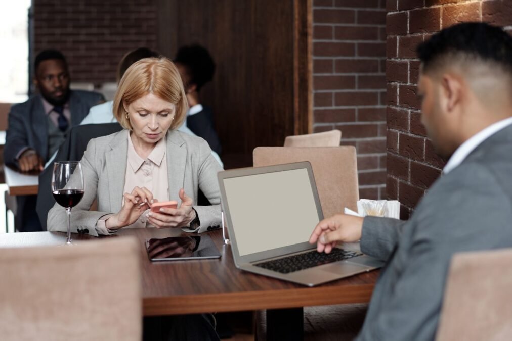 Business professionals networking over coffee at a modern cafe
