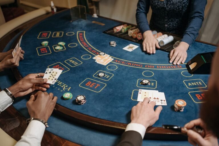 People playing a card game at a table, illustrating HearthStats-style deck tracking for Hearthstone